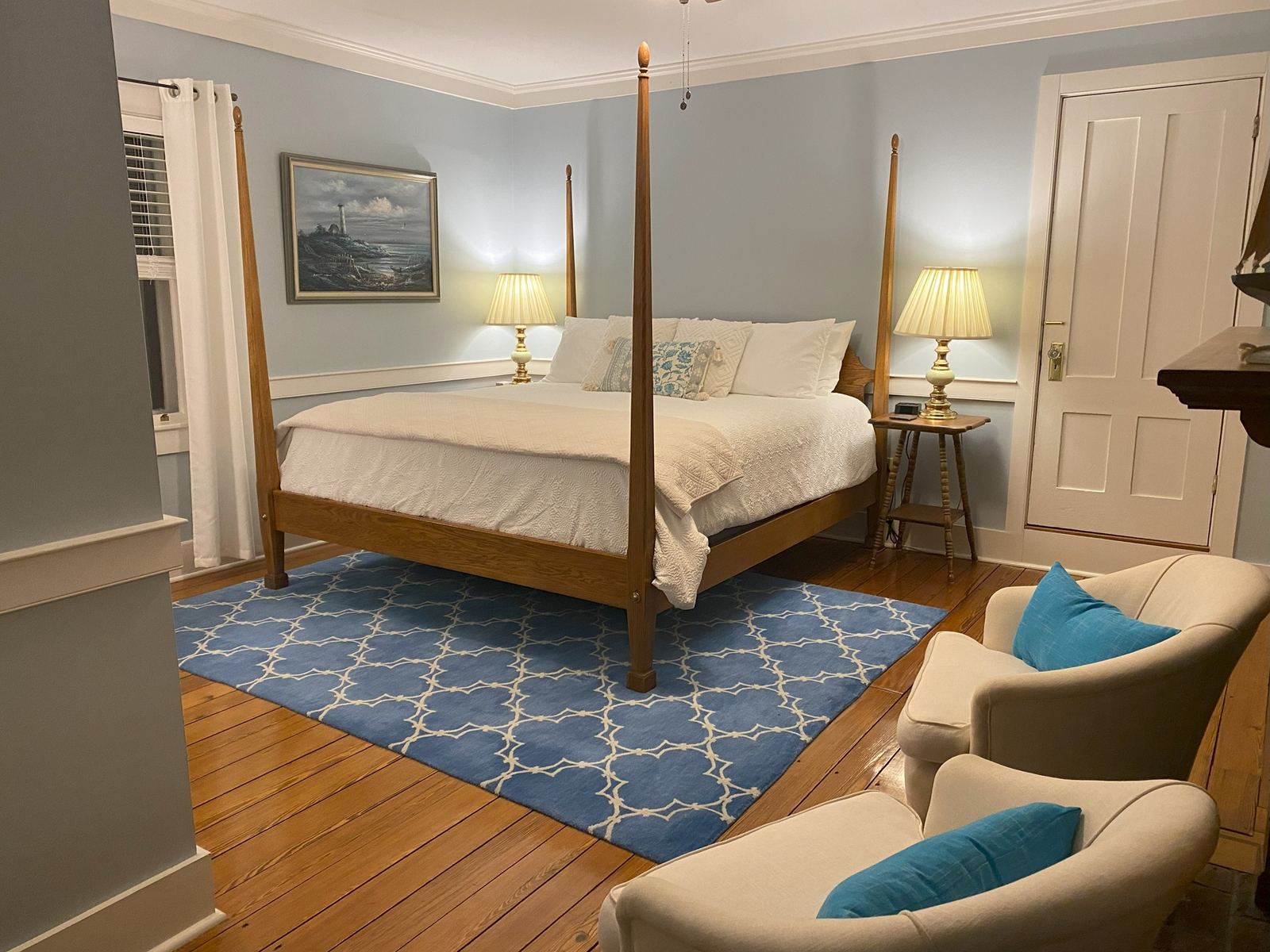 Navigator's Quarters: four-poster bed, sea-blue geometric rug and framed coastal artwork
